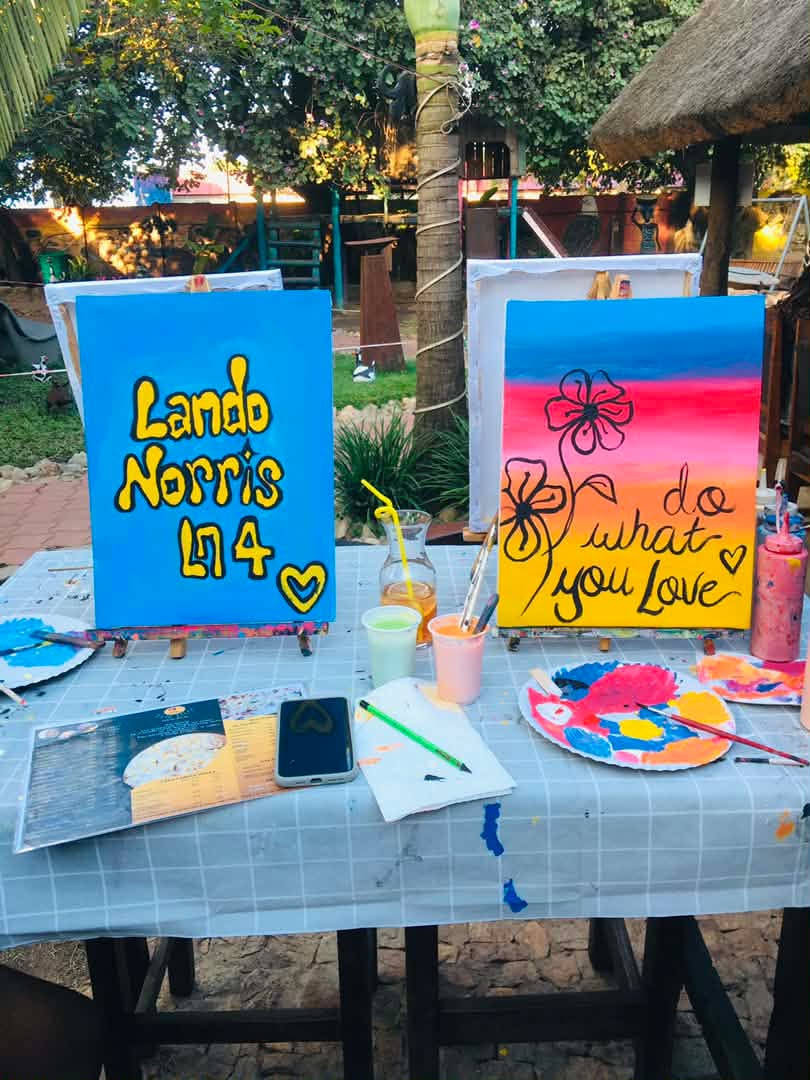 Finished 'do what you love' canvases on the table